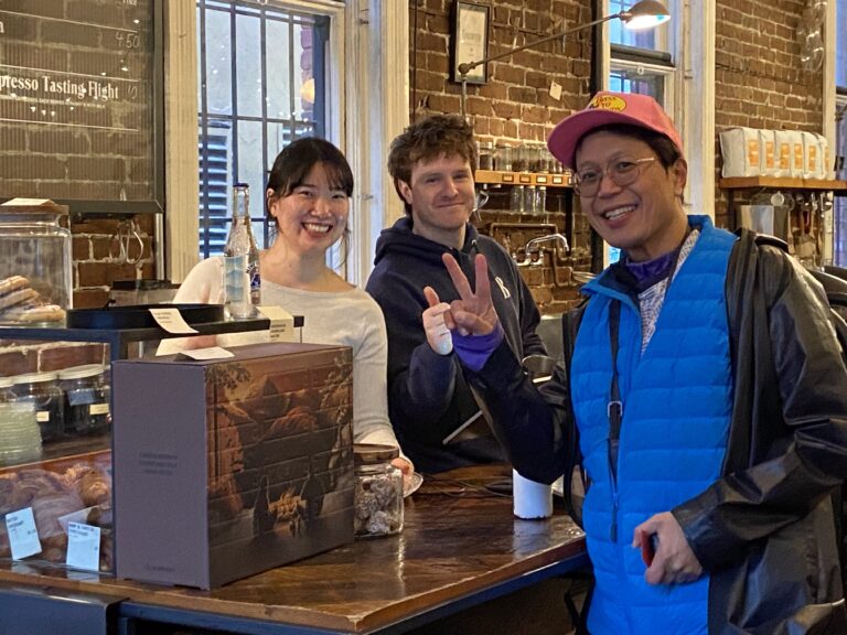 ayana, kevin and Roland at Revolver coffee in Gastown Vancouver posing with the V sign :-)