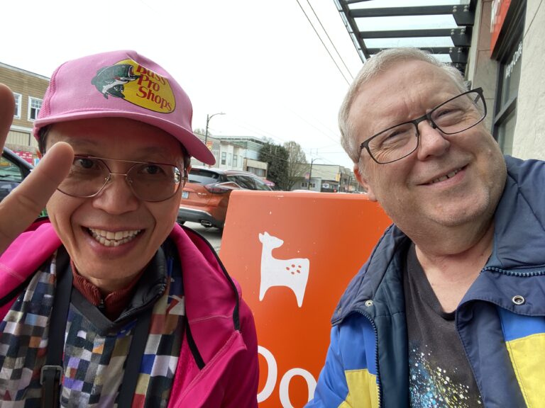 Dale and Roland outside Doe Coffee on a cloudy day on East Hastings. March 27, 2026